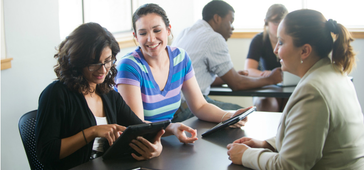 Group of people talking with tablet computers. 